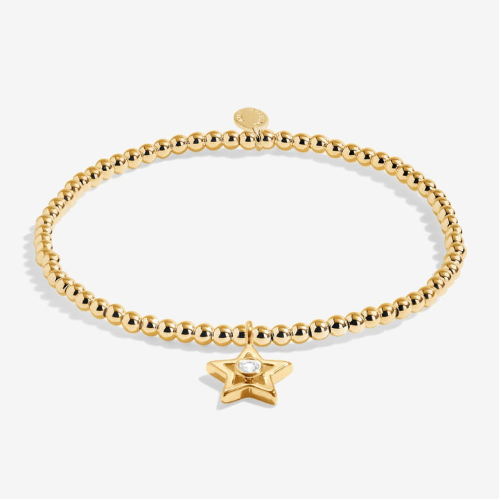 Gold beaded bracelet with a star charm.