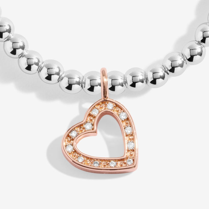 Silver and rose gold beaded "Happy Birthday" bracelet.