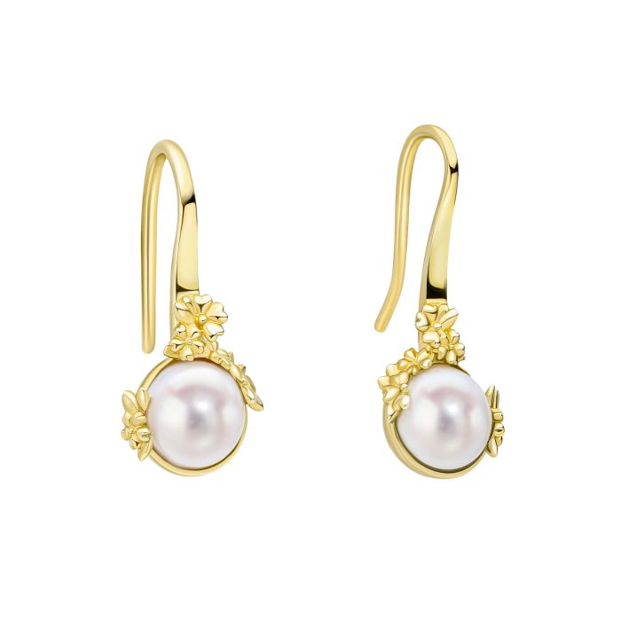 Pearl Tulip Earrings are gold-plated, recycled sterling silver earrings shaped like tulips, each holding a white freshwater pearl.