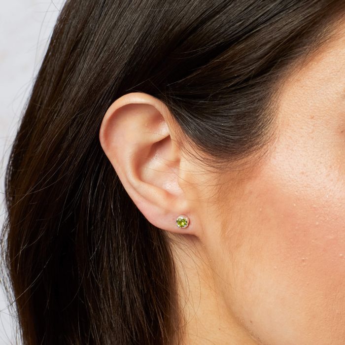 Peridot petal stud earrings in sterling silver.