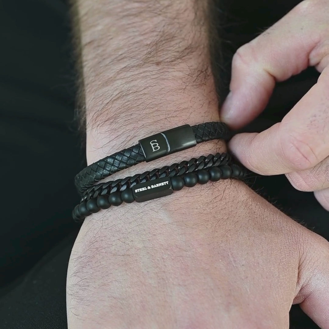 collection of mens bracelets on a wrist