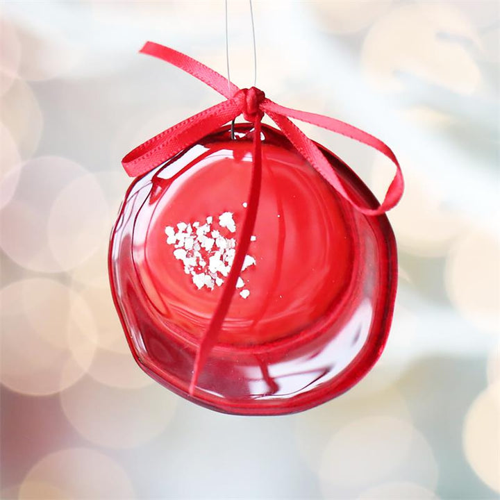 Handmade fused glass Christmas bauble in red, green, or blue.