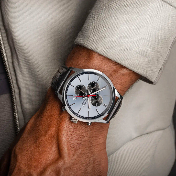 Sekonda chronograph watch with a silver case and black leather strap.