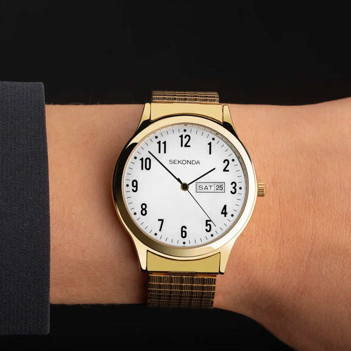 Gold watch with a white face and stainless steel band.