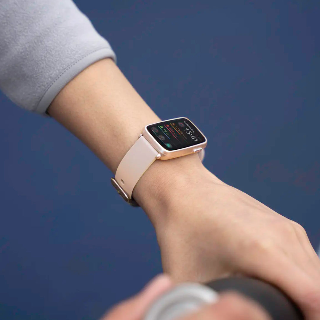 Sekonda smartwatch with a pink case and grey strap.