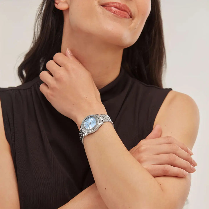 Blue Sekonda ladies watch with a rounded-octagonal face and stainless steel bracelet.