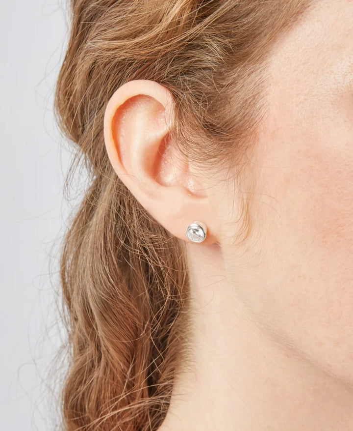 silver 7 mm bezel set cz stud earrings shown on model - Carathea & Jools