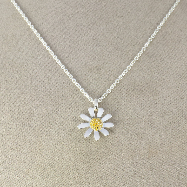 Sterling silver and gold daisy pendant necklace.