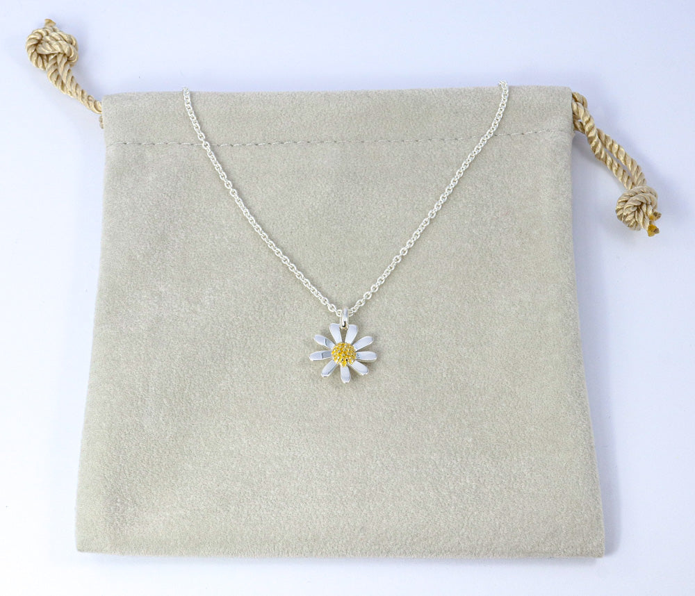 Sterling silver and gold daisy pendant necklace.