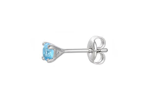 side view of silver and blue topaz stud earrings - Carathea