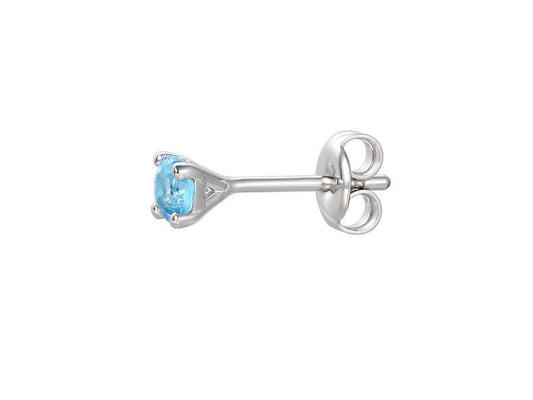 side view of silver and blue topaz stud earrings - Carathea