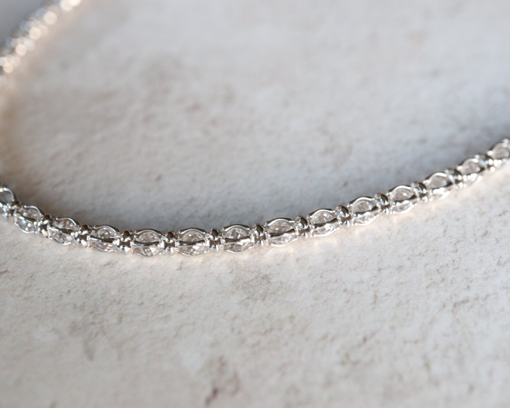 Cubic zirconia tennis necklace in sterling silver.