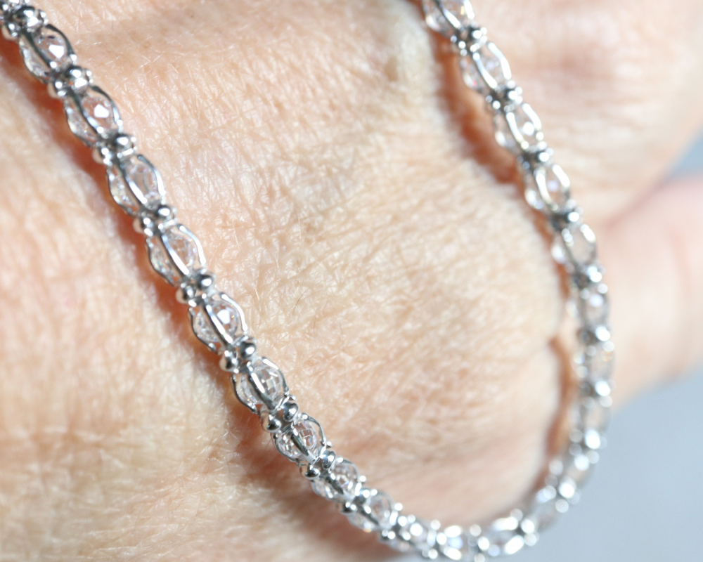 Cubic zirconia tennis necklace in sterling silver.