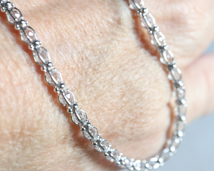 Cubic zirconia tennis necklace in sterling silver.