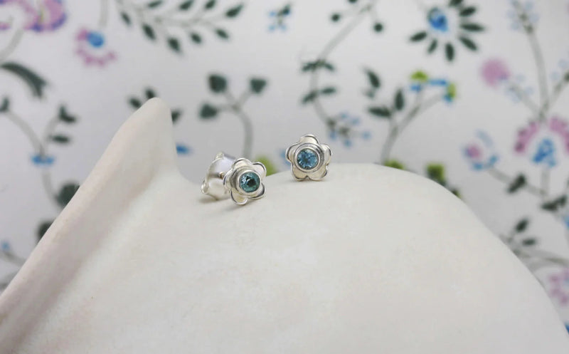silver flower stud earrings with blue topaz - Carathea jewellers
