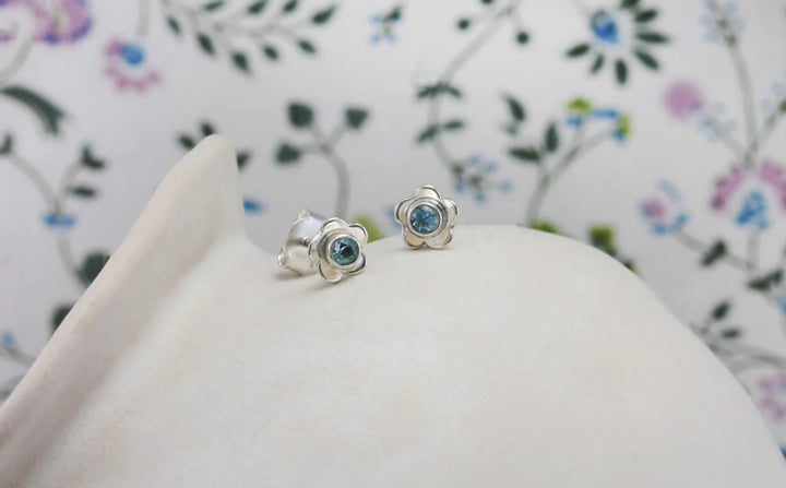 silver flower stud earrings with blue topaz - Carathea jewellers