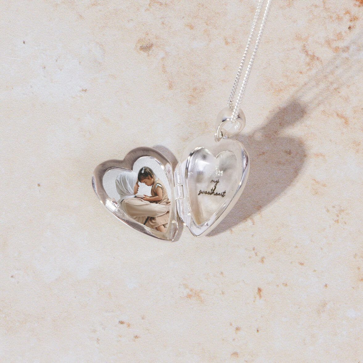 silver starburst locket with chain - Carathea