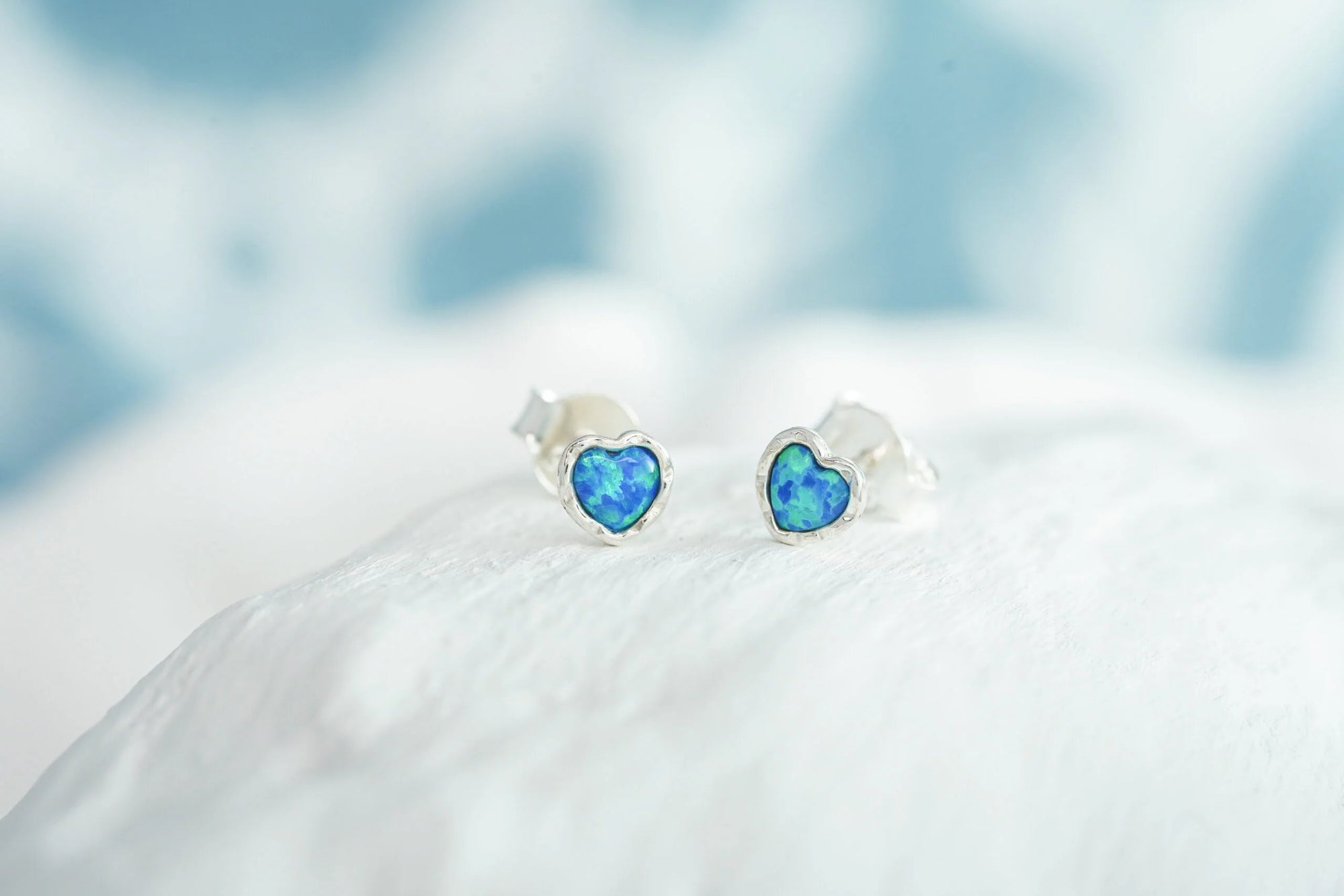 silver heart stud earrings set with Opalite stone - Earrings Carathea jewellers