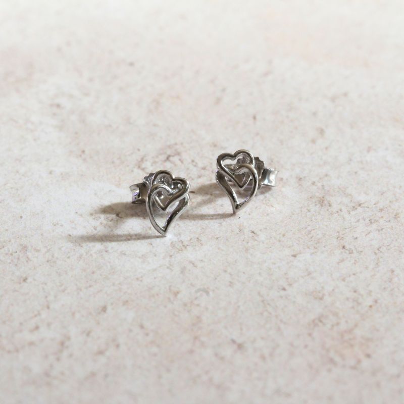 silver stud earrings with two open entwined hearts | Carathea