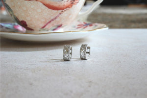 Silver Huggie Earrings with CZ Edges