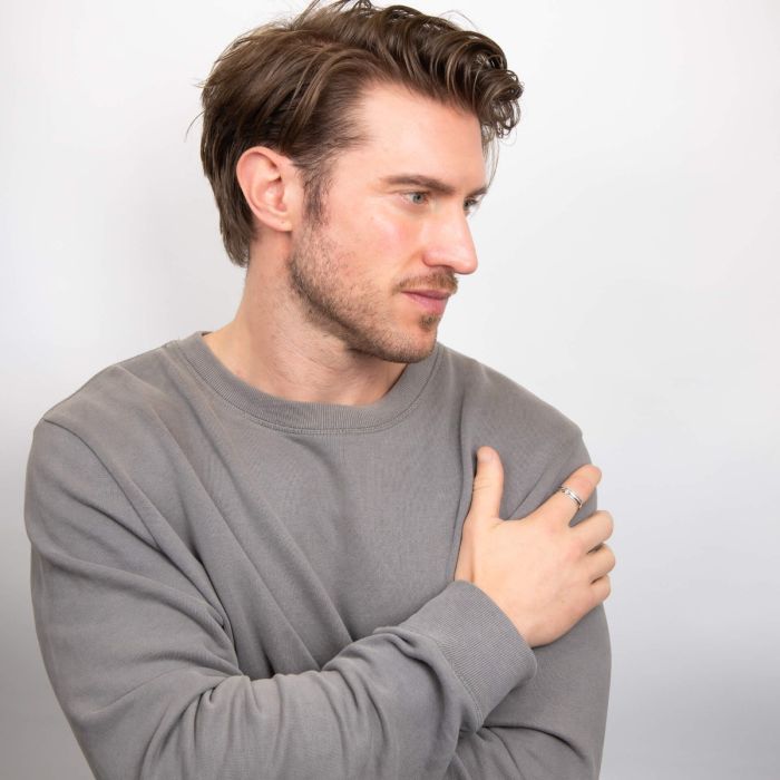 Silver spinner ring for calming focus.