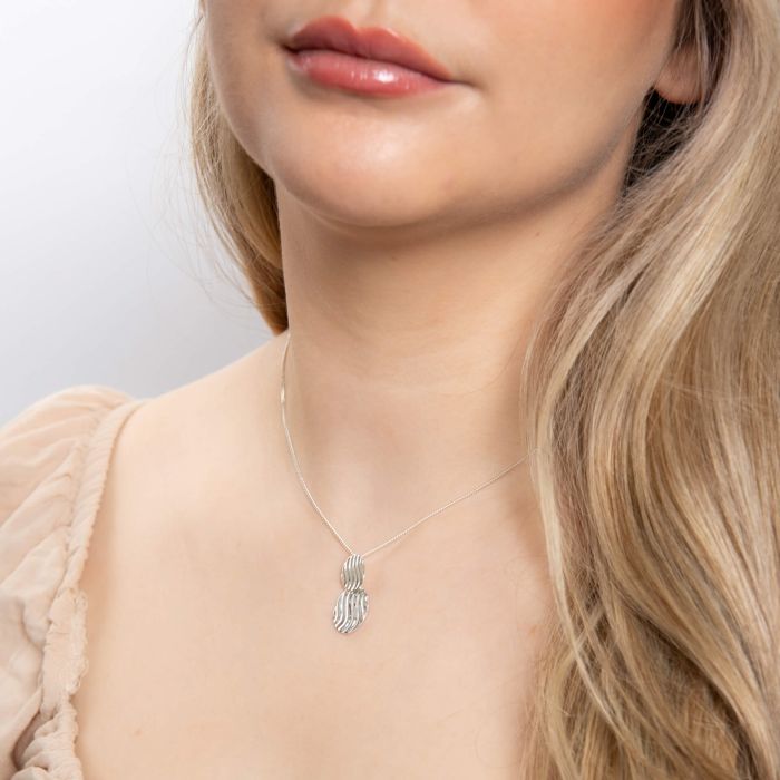 Wavy silver pendant.