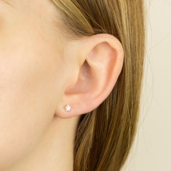 small silver star cz stud earrings on model - Carathea jewellers