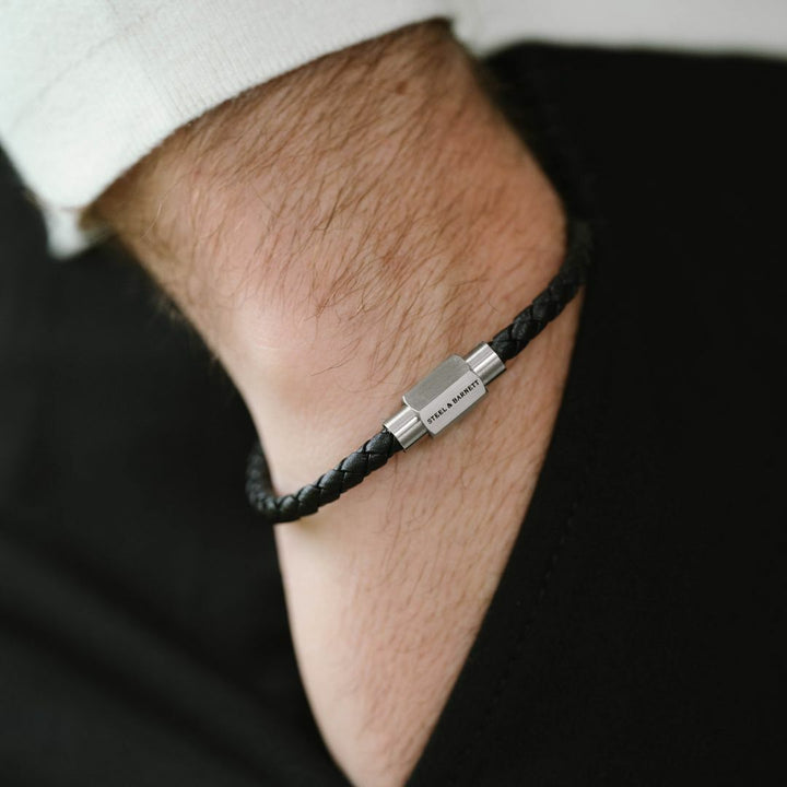 Black leather bracelet with a silver magnetic clasp.