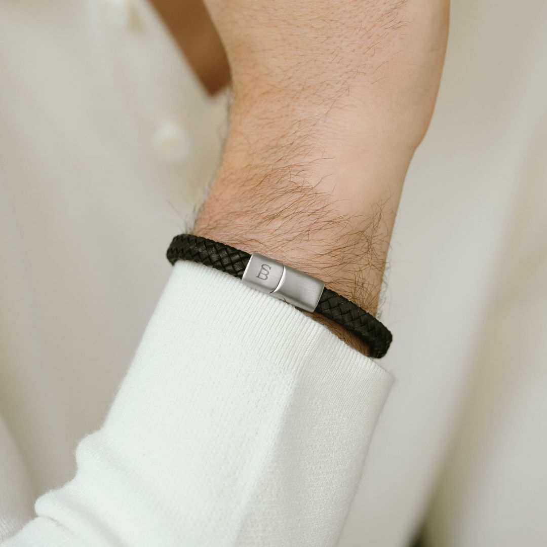 Black leather bracelet with a magnetic silver clasp.