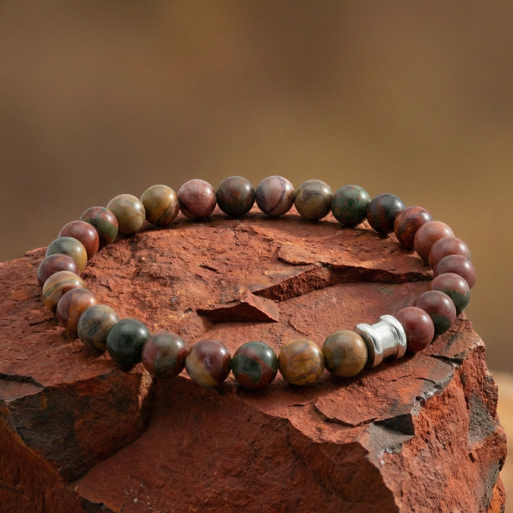 Multicolored beaded bracelet on a textured brown surface