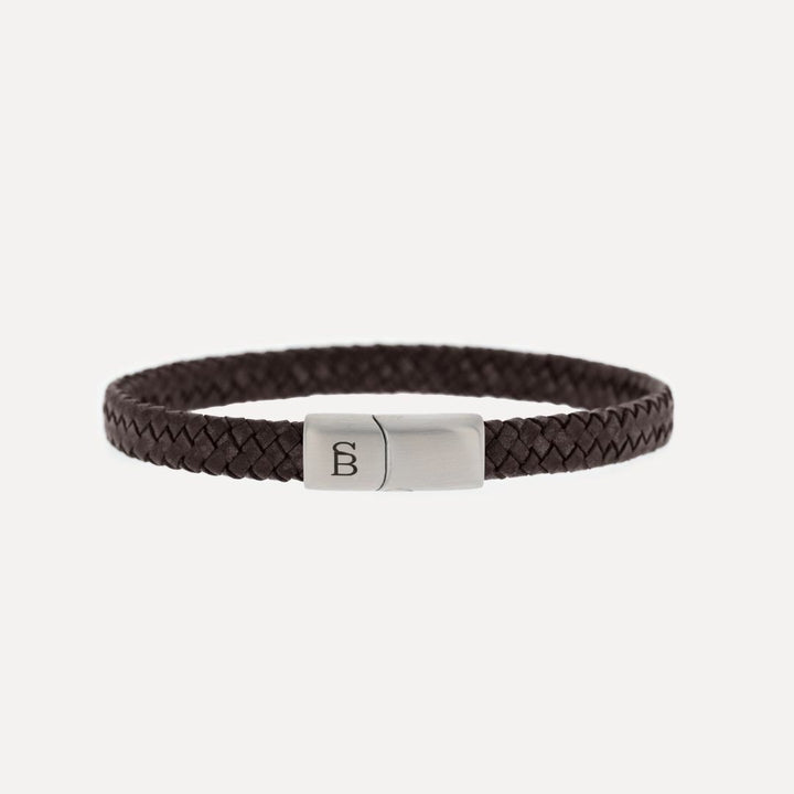 Brown braided leather bracelet with a silver magnetic clasp.