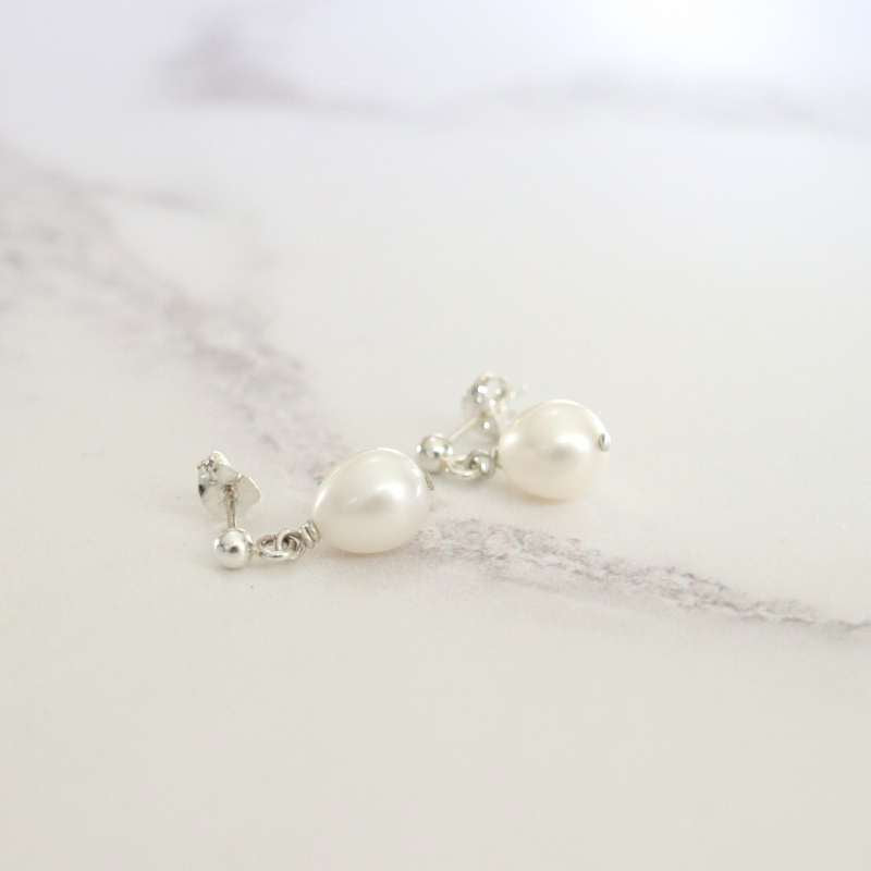 silver drop earrings with white barrel shape pearl earrings - Carathea jewellers