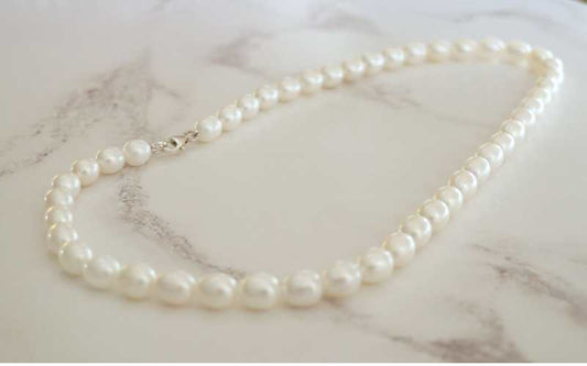 silver and barrel shaped white pearl necklace - Carathea jewellers