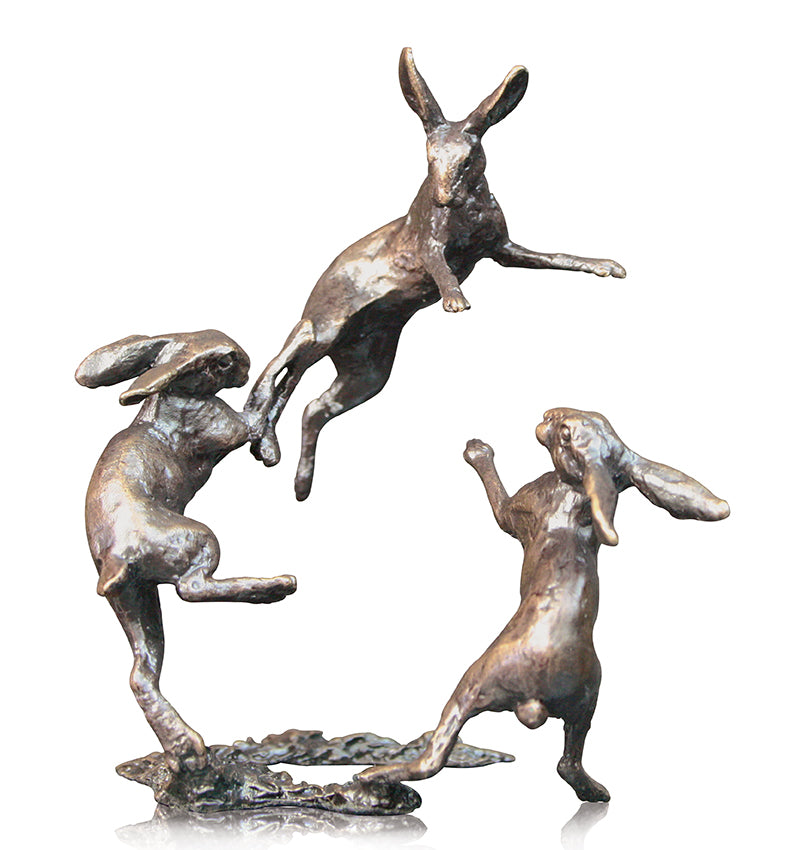 three hares dancing miniature sculpture in solid bronze Carathea jewellers.