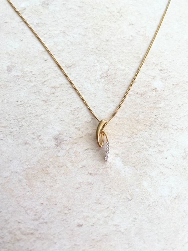 gold and diamonds swirl pendant Carathea Jewellers