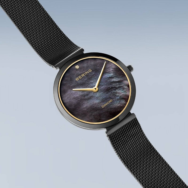 Ladies Bering watch in black with gold rim and diamond Watches Carathea