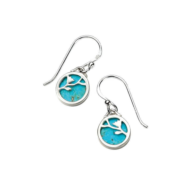 These are turquoise drop earrings with sterling silver settings and flower patterns, suitable as a December birthstone gift | Carathea & Jools