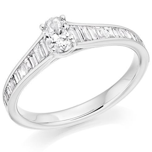 platinum engagement ring with oval central diamond and baguette shoulders Carathea jewellers
