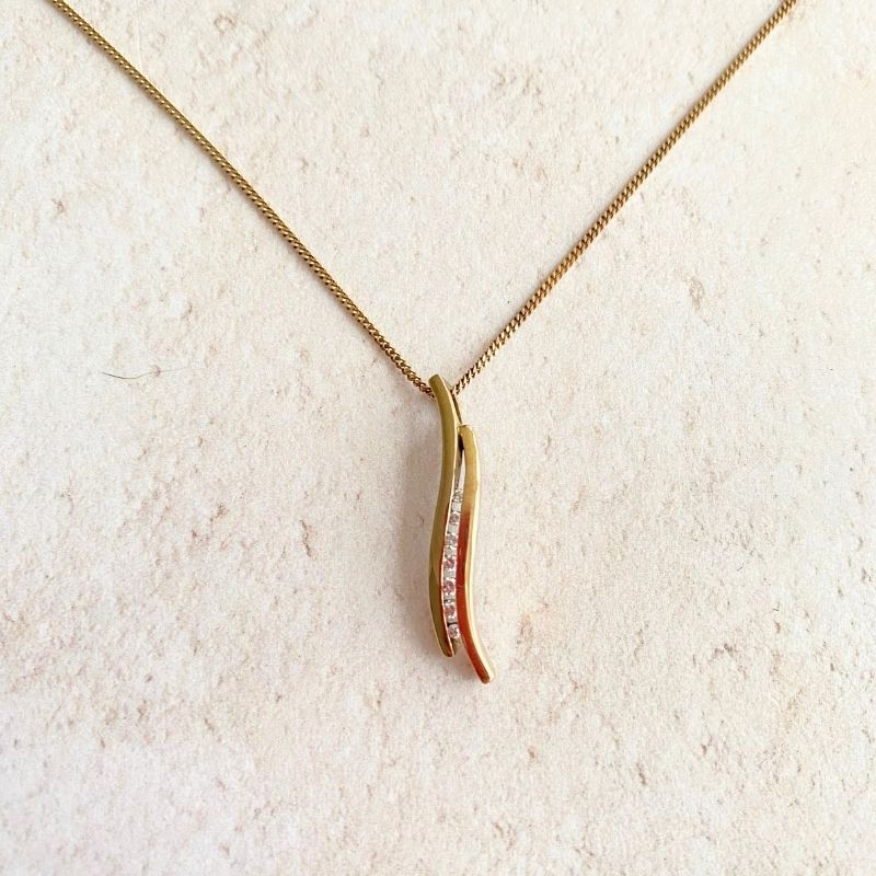 gold and diamond curve pendant necklace Carathea jewellers