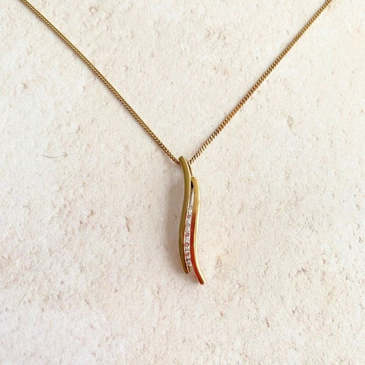 gold and diamond curve pendant necklace Carathea jewellers