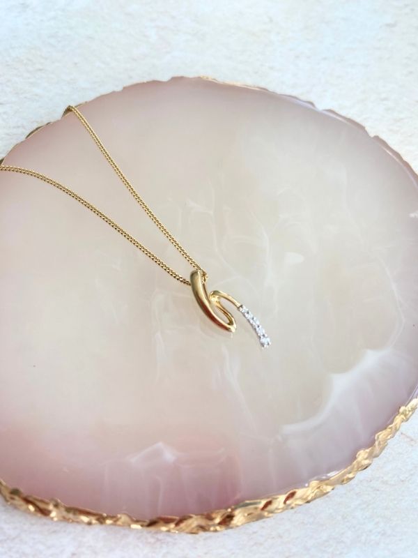 gold and diamonds swirl pendant Carathea Jewellers