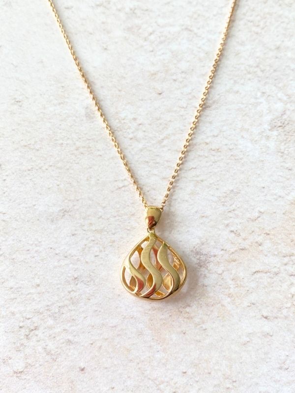 gold teardrop pendant in open swirls design Carathea jewellers