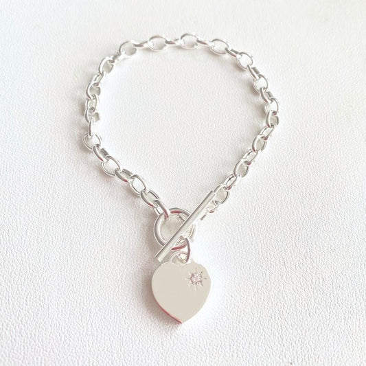 silver oval link charm bracelet with heart charm