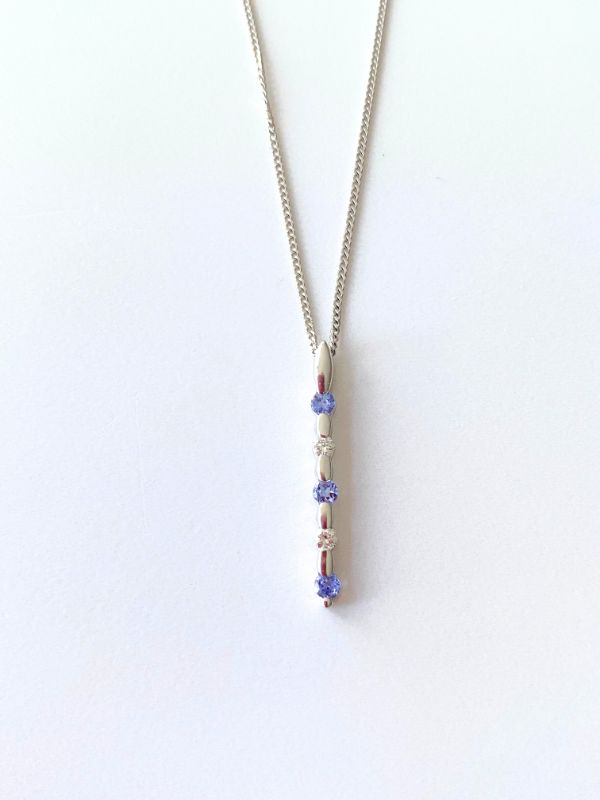 white gold tanzanite & diamond stick pendant Carathea jewellers